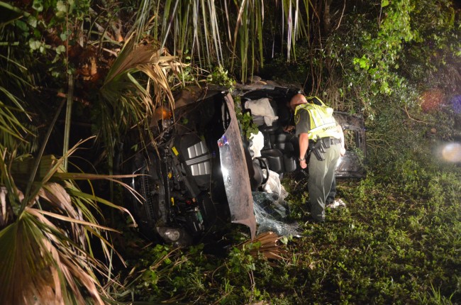 There wasn;t much left to the Hyundai Tuburon SUV after the wreck, and after firefighter-paramedics sheared off part of the vehicle to rescue its 24-year-old occupant. Click on the image for larger view. (© FlaglerLive)