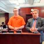 Ian Davis, left, with his defense attorney, Assistant Public Defender Bill Bookhammer, who argued on his behalf to limit Davis's prison sentence to nine or 10 years. He was sentenced to 15. (© FlaglerLive via zoom)