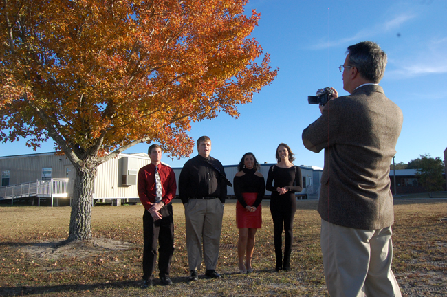 Living to tell the tale: from left, Anthony deAugustino, Devin Johnson, Mia Pagliaricci, Jordan Bryant, confessing to the greatness of the International Baccalaureate program to Roger Tangney. (© FlaglerLive)