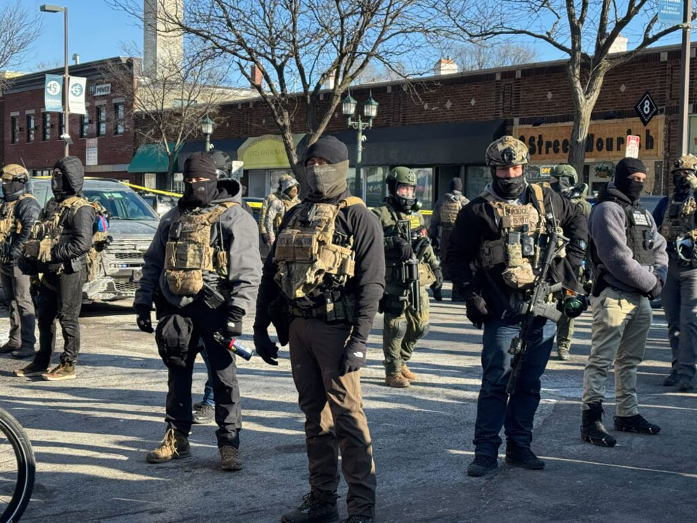 Masked federal agents on the scene near where a federal officer shot a Minnesotan for the third time in as many weeks. (Photo by Madison McVan/Minnesota Reformer)