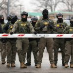 U.S. Border Patrol agents stand guard at the Bishop Henry Whipple Federal Building in Minneapolis, Minn., on Jan. 8, 2026.