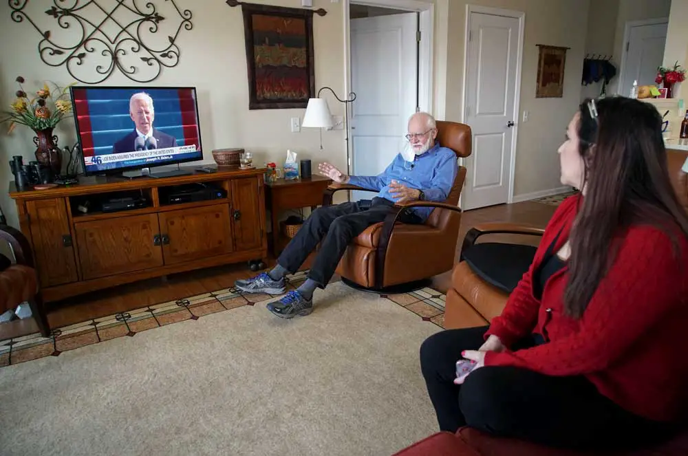Joe Biden and Donald Trump supporters, like these two, are more likely to be polarized by TV news than online echo chambers. AP Photo/Allen G. Breed
