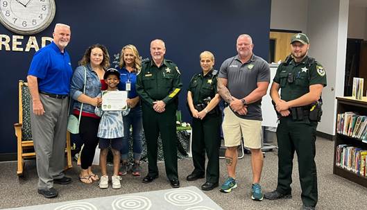 Sheriff Staly and Deputy Erlandson presented Karter Consolazio with a certificate for a scholarship to attend the FCSO Crime Scene Investigation (CSI) Academy this summer. (FCSO)