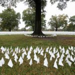 An estimated 240,000 flags were planted on the DC Armory Parade Ground in front of RFK Stadium during a two-week participatory exhibition by Suzanne Brennan Firstenberg. Flags were to be added daily as the death count rises.