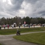 Indivisible Flagler's demonstration in Palm Coast in support of the impeachment of President Trump, echeduled in the House of Representatives on Wednesday afternoon. The demonstration took place along State Road 100, near Panera Bread, one of 600 such demonstrations across the country. (© FlaglerLive)