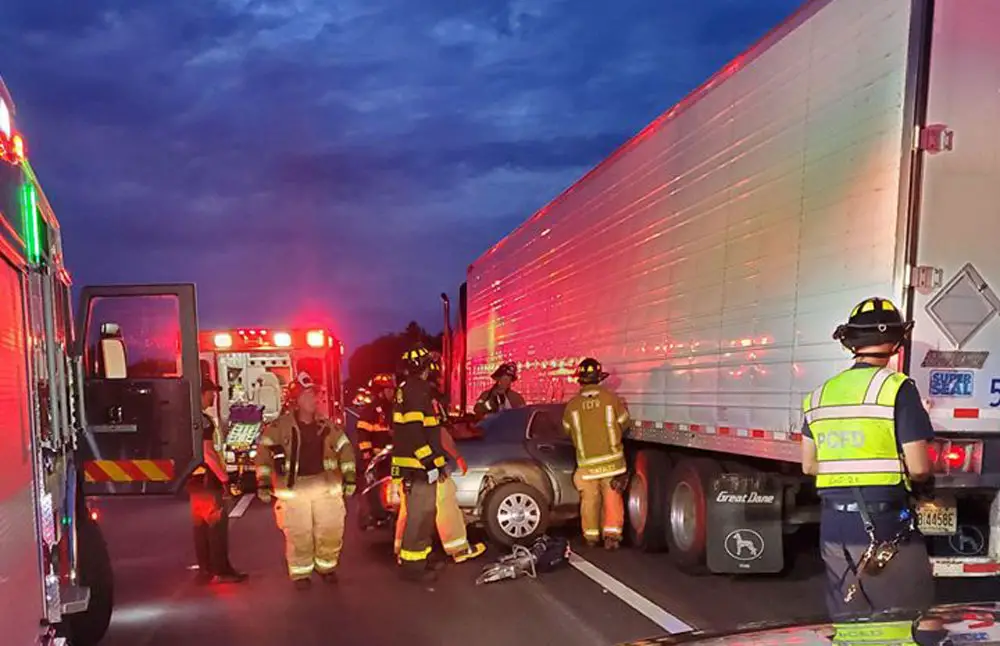 The three occupants of the Lincoln Town Car escaped with only minor injuries in a crash with a semi on I-95 Friday evening. (FCSO)