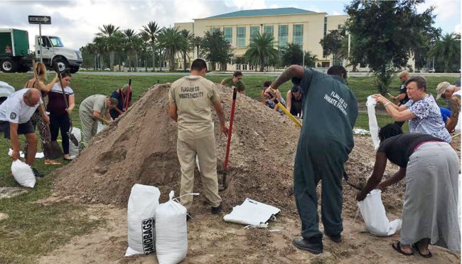 Inmates helped fill sandbags in Bunnell in preparation for Hurricane Irma two years ago. (c FlaglerLive)