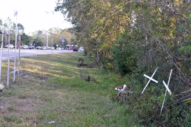 The U.S. 1 intersection at the White Eagle Lounge has been a graveyard: the scene today, a juxtaposition of crosses from previous wrecks as traffick backs up following today's death. Click on the image for larger view. (© FlaglerLive)
