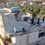 The rubble after the raid on Islamic State group leader Abu Ibrahim al-Hashimi al-Qurayshi. (AP Photo/Ghaith Alsayed)