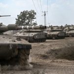 Israeli tanks gather near the border with the Gaza Strip on Oct. 13, 2023.