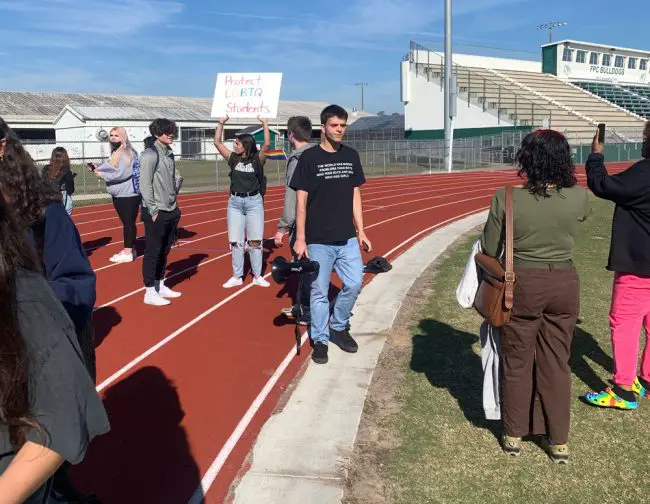 Student leader Jack Petocz was suspended almost immediately after the protest he organized today at FPC. His shirt reads: "