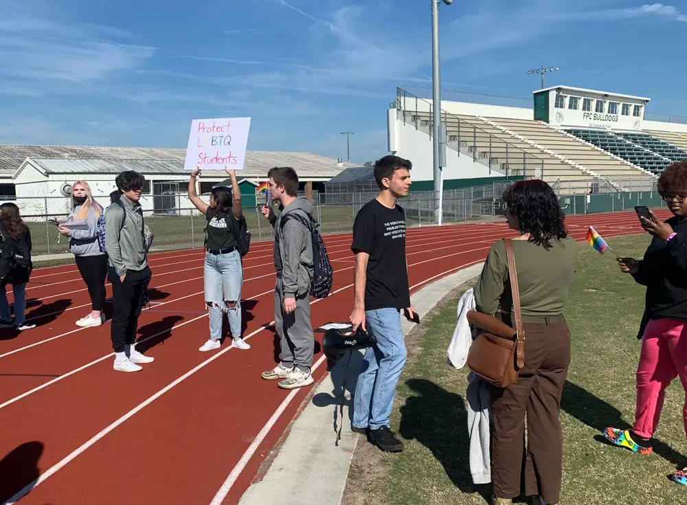 Jack Petocz, near the center with a bullhorn, was one of several students suspended at Flagler Palm Coast High School and Matanzas High School for different reasons following Thursday's walkout protesting lawmakers' "Don't Say Gay" bill. As of this afternoon, Petocz said he still didn't know how long his suspension was to be. 