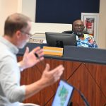 Bunnell City Manager Alvin Jackson at a City Commission meeting as Chad Grimm, developer of the 6,100-home Reserve at Haw Creek the commission approved, spoke. (© FlaglerLive)