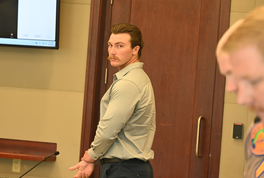 Jayden Jackson today during his sentencing hearing. The two Florida Highway Patrol troopers in the foreground are the traffic homicide investigators who investigated Jackson's hit-and-run crash that took the life of Shaunta Cain. 54, on U.S. 1 in 2022. (© FlaglerLive)