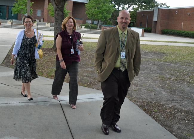 Jacob Oliva with Flagler Palm Coast High School's new principal, Lynette Shott, and Superintendent Janet Valentine. (© FlaglerLive)