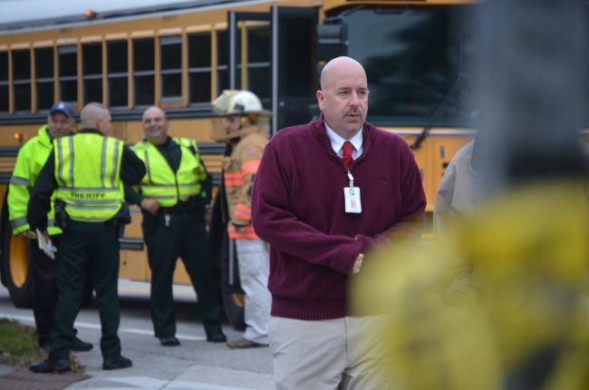 Superintendent Jacob Oliva was at the crash scene before heading to the hospital to confer with parents, students and health officials. Click on the image for larger view. (c FlaglerLive)