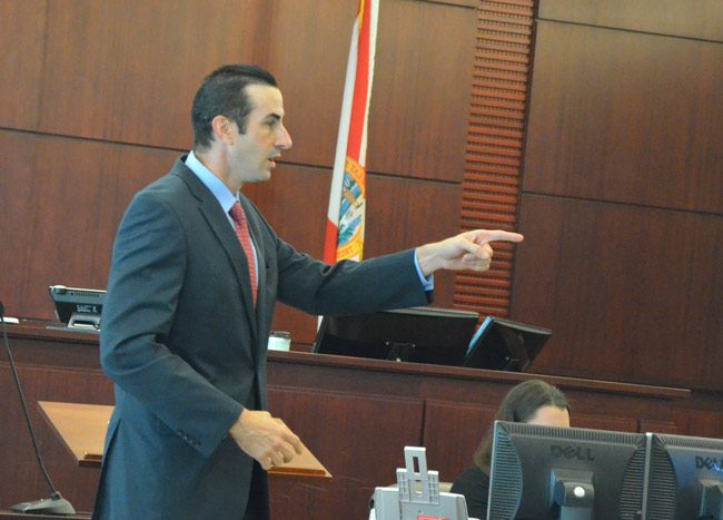 Assistant State Attorney points an accusing finger at Paul Dykes during open arguments in Dyke's trial Tuesday morning. (© FlaglerLive)