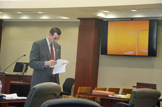 Assistant State Attorney Jason Lewis, going over his closing moments before the jury was brought back in  from a break. Click on the image for larger view. (© FlaglerLive)