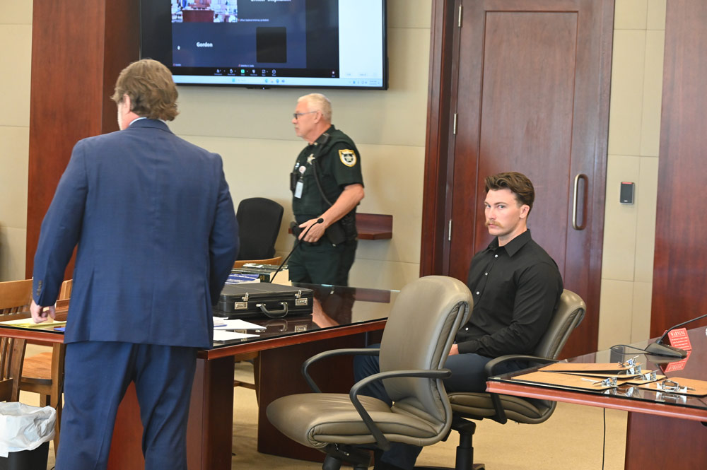 Jaydeon Jackeon, right, with his attorney, Josh Davis, during today's plea hearing before Circuit Judge Dawn Nichols. (© FlaglerLive)