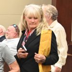 Jeani Duarte arriving in court last July, among the partisans of Mayor Mike Norris, who was suing the city. Duarte is a candidate for the Palm Coast City Council. (© FlaglerLive)