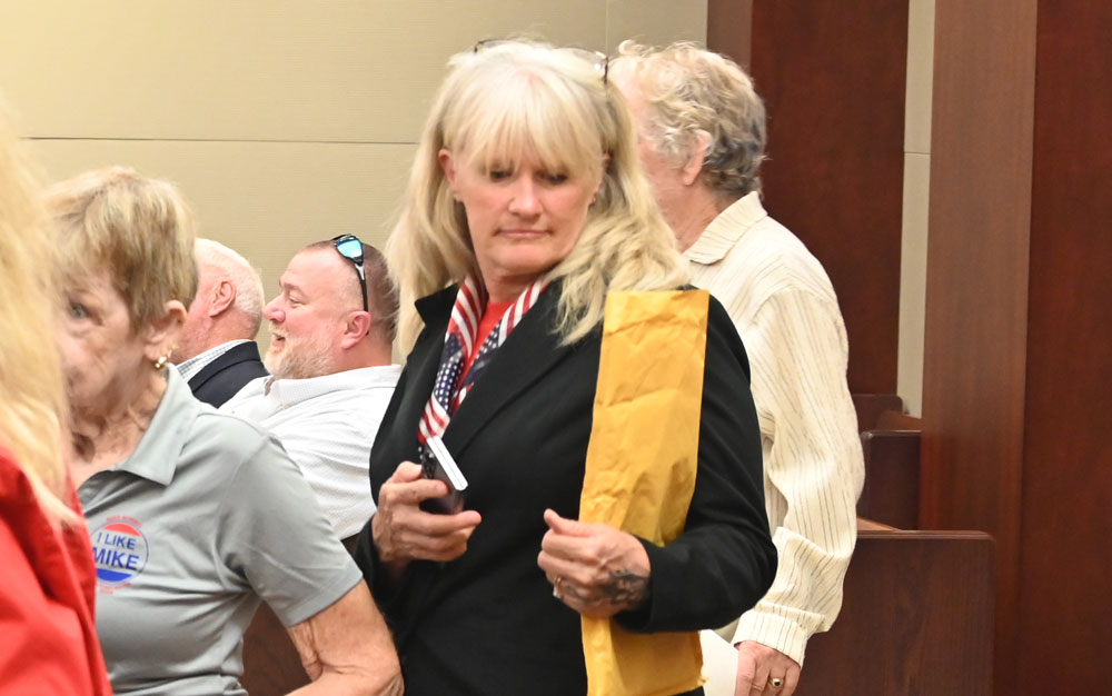 Jeani Duarte arriving in court last July, among the partisans of Mayor Mike Norris, who was suing the city. Duarte is a candidate for the Palm Coast City Council. (© FlaglerLive)