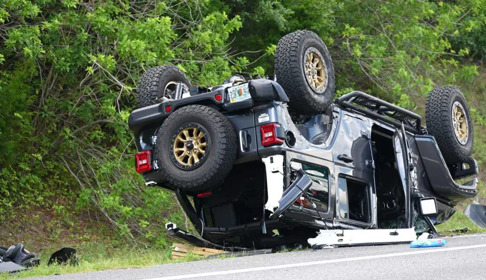 Two occupants, including a child, were reported thrown from the Jeep in a three-vehicle crash today  near midday on the approach of the Flagler Beach bridge. (© FlaglerLive)