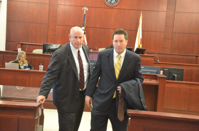 Defense attorneys Jeff Stone and Michael Nielsen leaving the courtroom after the verdict. (© FlaglerLive)