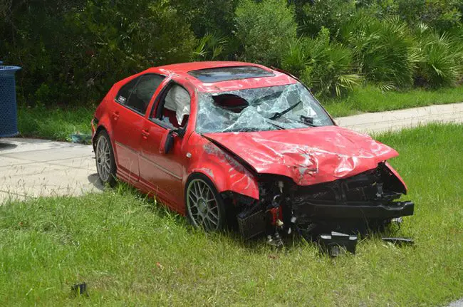 The Volkswagen Jetta after the crash on Seminole Woods Boulevard at noon. (© FlaglerLive)