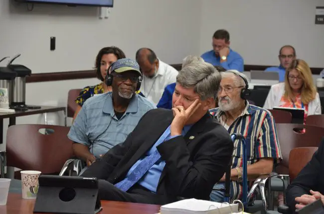 Palm Coast City Manager Jim Landon in customary recline at this week's workshop with the council. (© FlaglerLive)