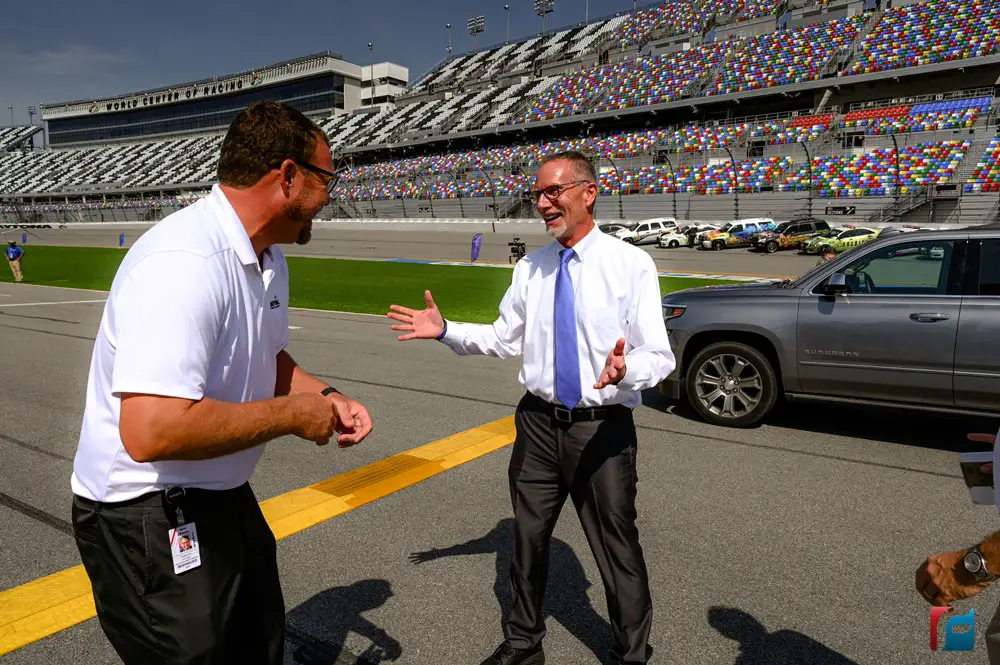 Superintendent Jim Tager, right, with Chip Wile, president of Daytona International Speedway, Sunday. (Flagler Schools)