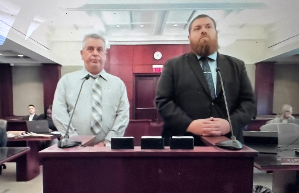 The pursed lips were not an act: Joao Fernandes, left, adamantly told a judge Wednesday that he wanted his trial on a hit-and-run charge, and thought himself innocent despite what the judge characterized as convincing evidence otherwise. (© FlaglerLive via zoom)
