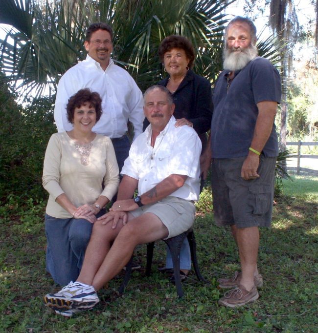 John, seated, with Marylyn, and from left, standing, his brother Andy, his mother Nancy, and ... 