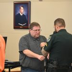 John Garrison's freedom ended at 2:26 this afternoon at the Flagler County courthouse, where he was sentenced to three years in prison and 10 years on probation. (© FlaglerLive)