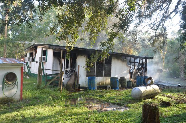 This is the house that Jack built in 1988, and where his son John Martin and his wife Grace lived in. It was demolished by fire in less than an hour this afternoon. Click on the image for larger view. (c FlaglerLive) 