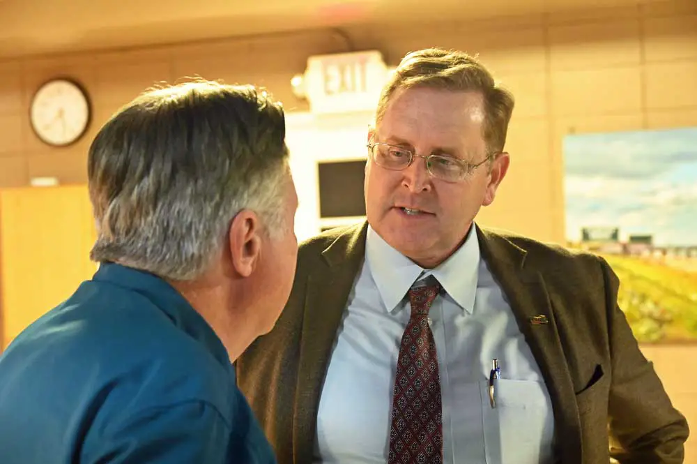 John  Tyler, the Florida Department of Transportation's District 5 secretary, speaking with Flagler Beach City Manager William Whitson after tonight's City Commission meeting. District 5 covers nine central Florida counties, including Flagler, Volusia and Brevard. (© FlaglerLive)