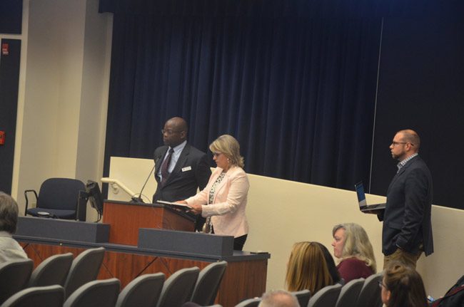 Earl Johnson, left, the district's point man on the Social Sentinel contract, the company's Heather, a sales director, and technology director Ryan Diesing, speaking to the school board Tuesday evening. (© FlaglerLive)