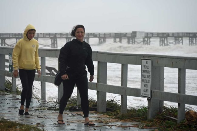 Mayor Suzie Johnston and her daughter surveying A1A near the height of the storm this morning. (© FlaglerLive)