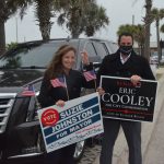 Suzy Johnston and Eric Cooley late this afternoon, a distance from the polling station at City Hall in Flagler Beach. (© FlaglerLive)