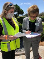 Tax Collector Suzanne Johnston, right, during the visits to property owners along A1A in mid-May. (Flagler County)