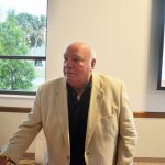 The late Jon Netts, who had been Palm Coast's mayor and a member of the council, in a speaking appearance at the Palm Coast Community Center in April 2018. His family would like the center named after him. David Alfin, the current mayor, is cool to the idea. (© FlaglerLive)