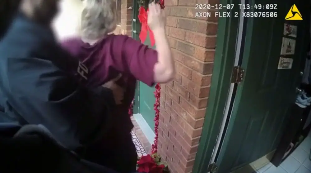 Rebekah Jones as FDLE agents led her outside her home on Dec. 7, in a still from a body cam video. 
