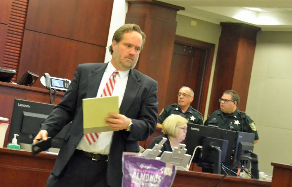 Attorney Josh Davis had to order his client out of the courtroom this afternoon after the client, facing a felony charge of domestic violence, had an outburst following a ruling by the judge he did not like. (© FlaglerLive)
