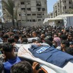 A funeral ceremony takes place in the courtyard of Nasser Hospital in Gaza following the deaths of five journalists on Aug. 25, 2025.
