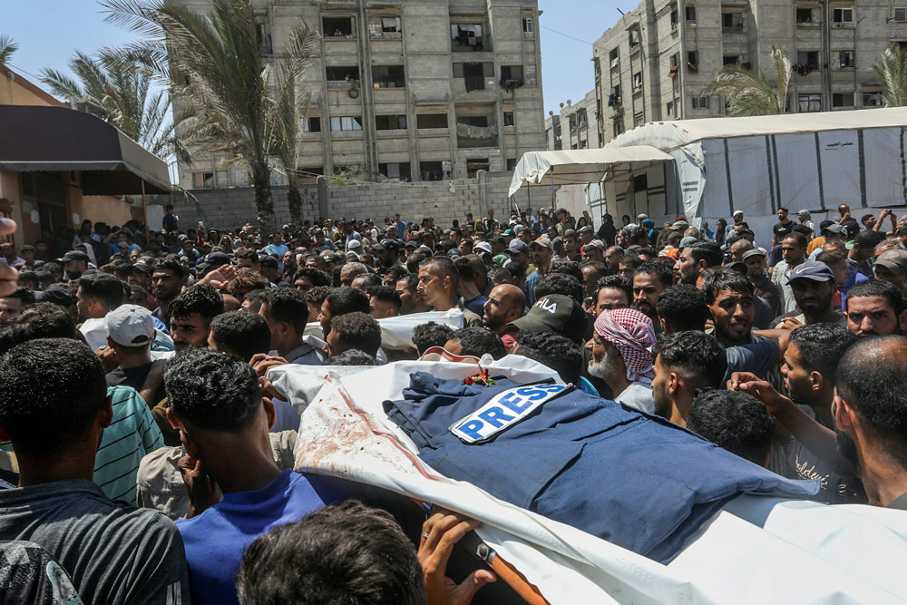 A funeral ceremony takes place in the courtyard of Nasser Hospital in Gaza following the deaths of five journalists on Aug. 25, 2025.