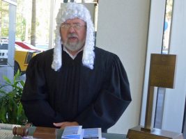 Closet barrister Robert Cuff, the Palm Coast City Council member, was the judge today, holding the bench at Palm Coast Ford. Click on the image for larger view. (© FlaglerLive)