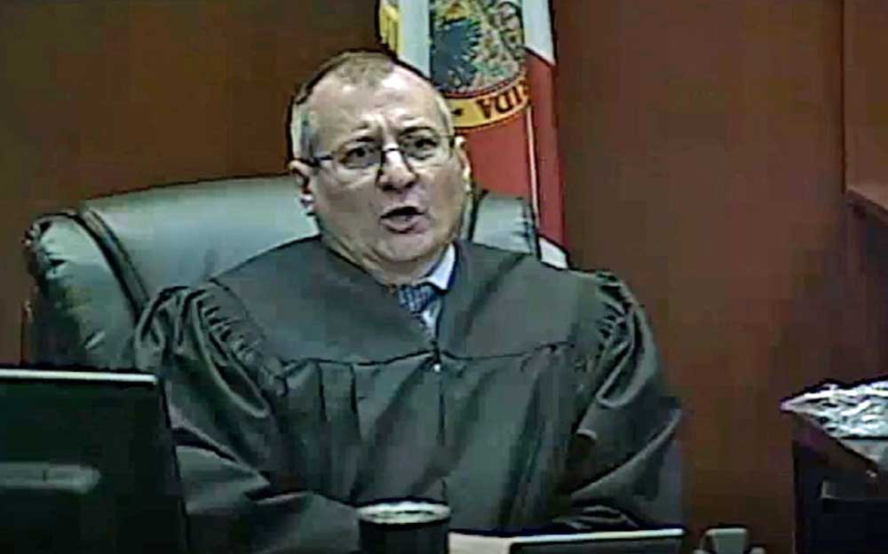 Judge Wayne Culver telling a man in the courtroom to "shut up," before becoming more crass and threatening the man with jail, on Feb. 10, 2022.