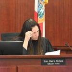 Circuit Judge Dawn Nichols going over the inexplicable verdict form this afternoon. (© FlaglerLive)