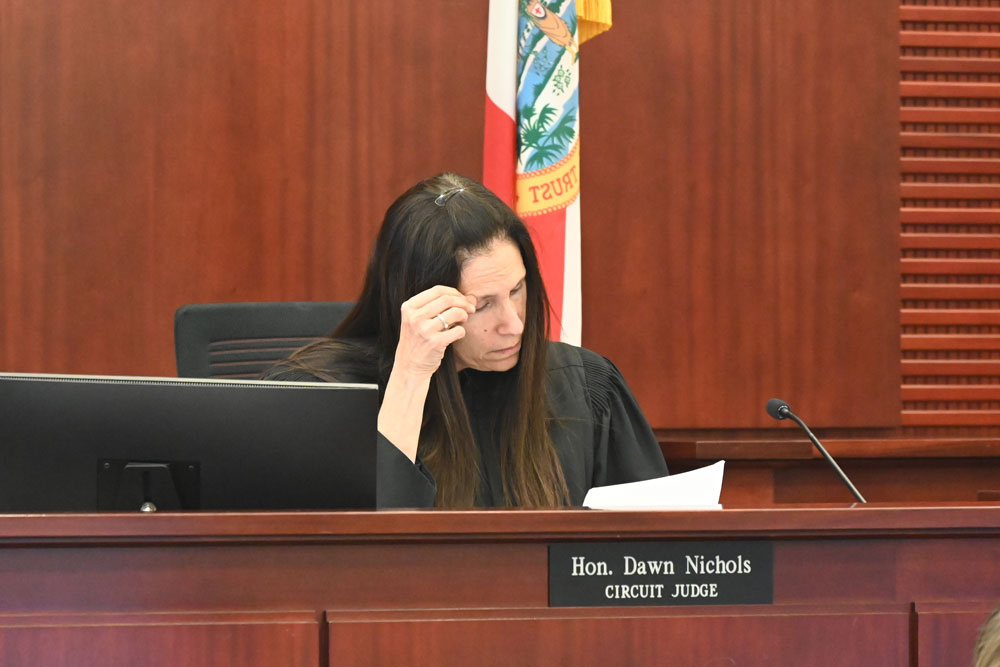 Circuit Judge Dawn Nichols going over the inexplicable verdict form this afternoon. (© FlaglerLive)