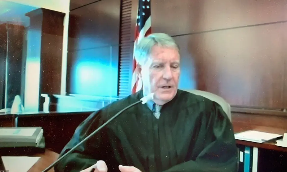 Circuit Judge Perkins in court today. He denied Flagler County government's motion to dismiss a lawsuit against it by Captain's BBQ, the restaurant at Bing's Landing. (© FlaglerLive)