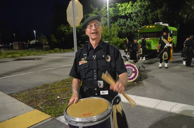 Look who joined Coastal Florida Police and Fire Pipes and Drums, the popular group of performers often seen at ceremonially solemn functions around town, from commemorations of Memorial or Veterans Day to--as was the case Monday--fallen officers memorials: it's Circuit Judge J. David Walsh, who retired from Flagler's felony bench in 2016, but who's been busy since, putting in duty as a retired judge at the courthouse. Walsh says he's always been a drummer and was eager to get back to it. (© FlaglerLive)